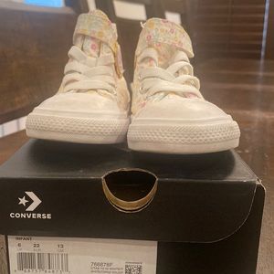 Infant Converse Size: 6 Color: White with pink/yellow flowers Box included